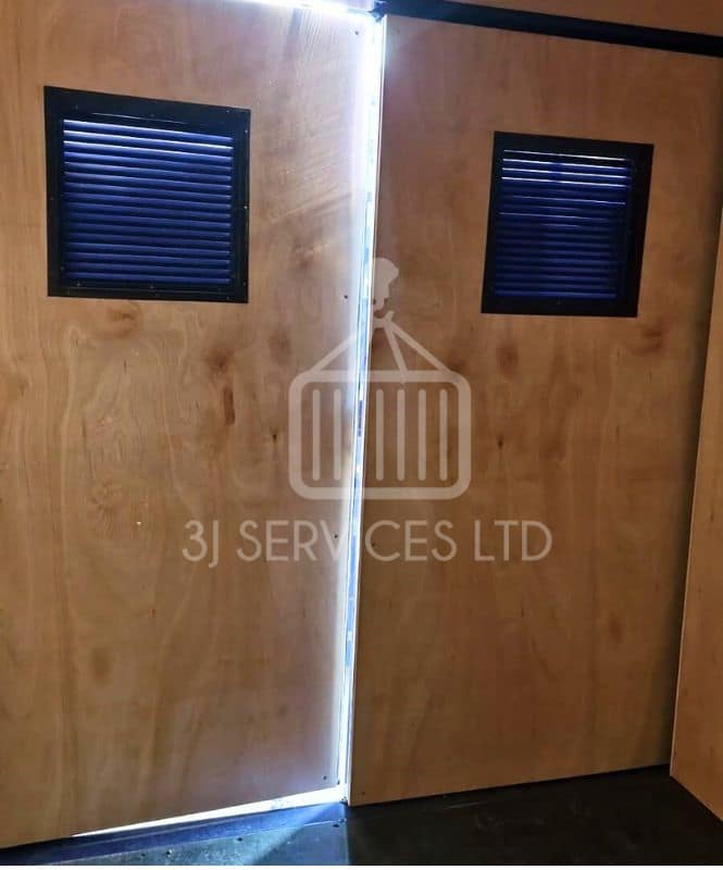 inside a 10ft container showing ply lined doors