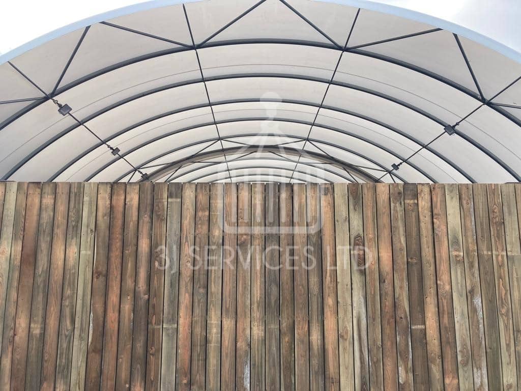 Cladded shelving container