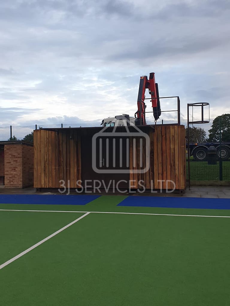 Cladded shelving container