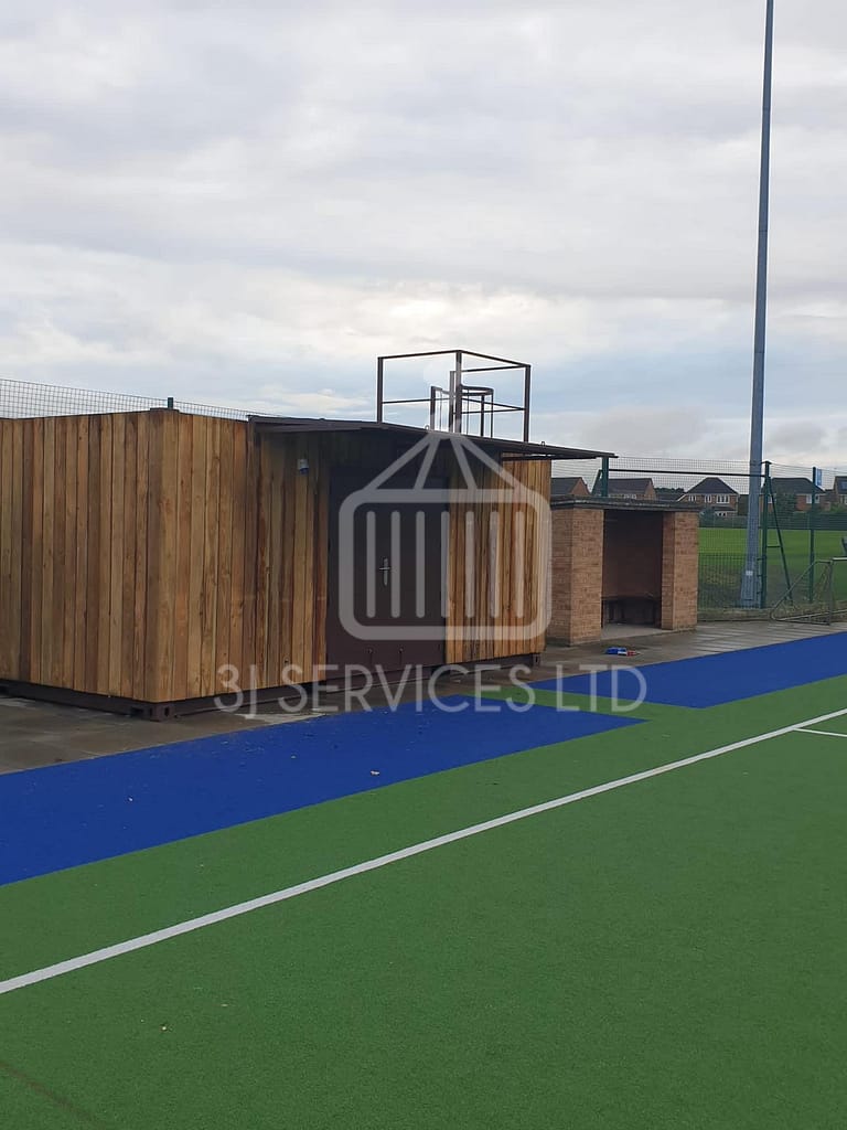 Cladded shelving container