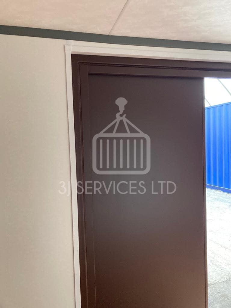 Cladded shelving container