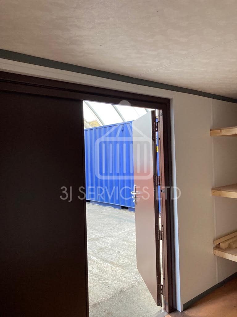 Cladded shelving container