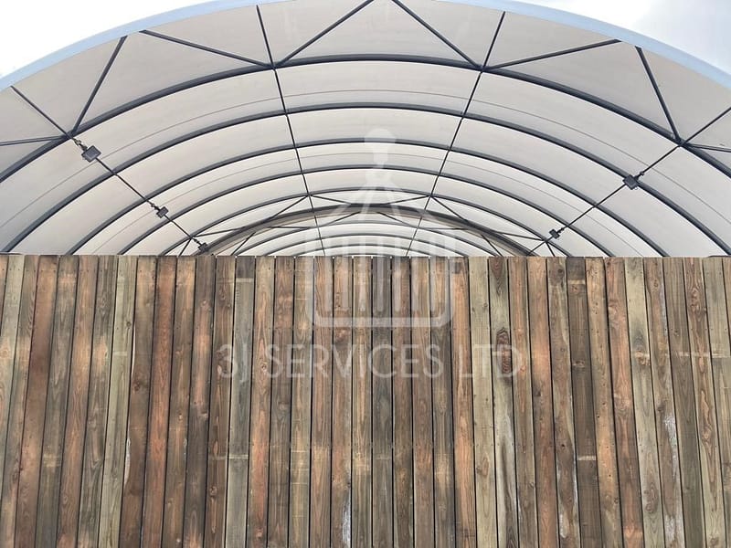 Cladded shelving container