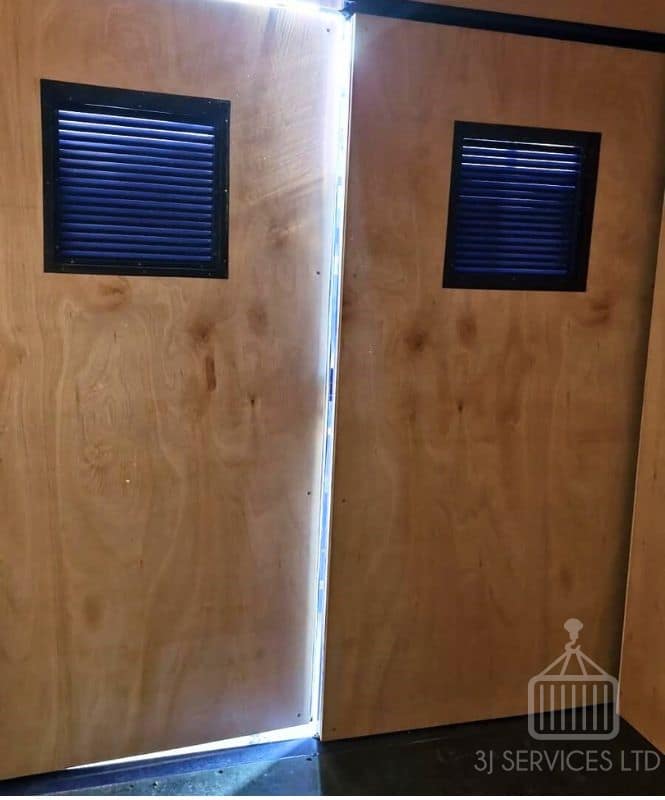 inside a 10ft container showing ply lined doors