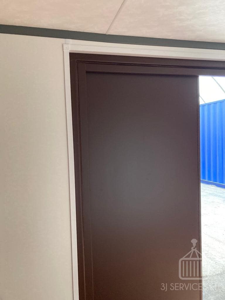 Cladded shelving container