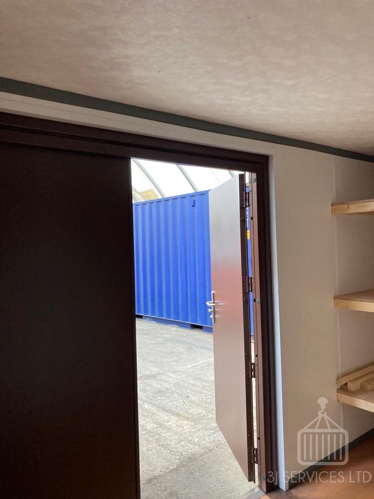 Cladded shelving container